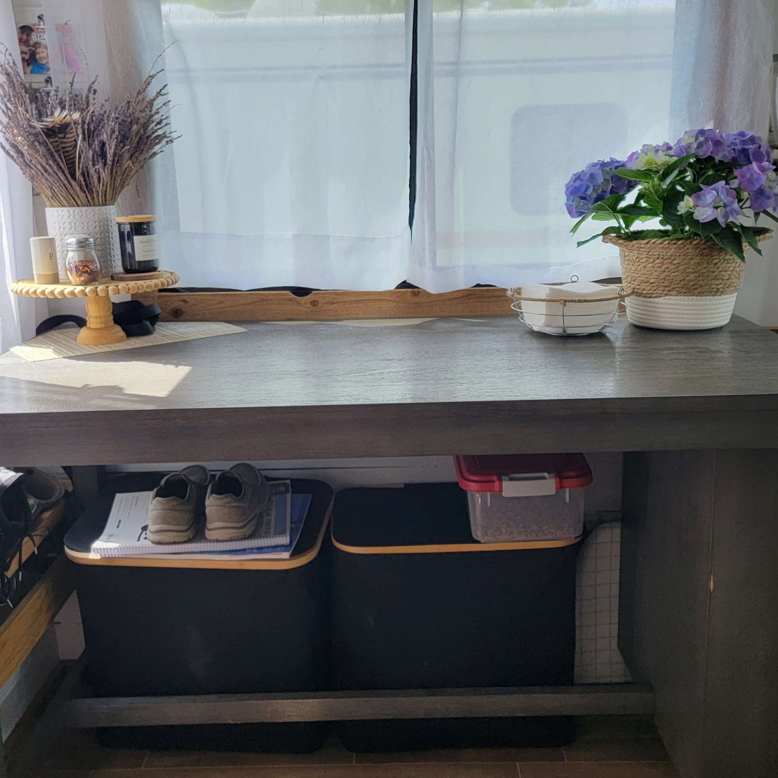 Homer the RV kitchen update with storage under dining table