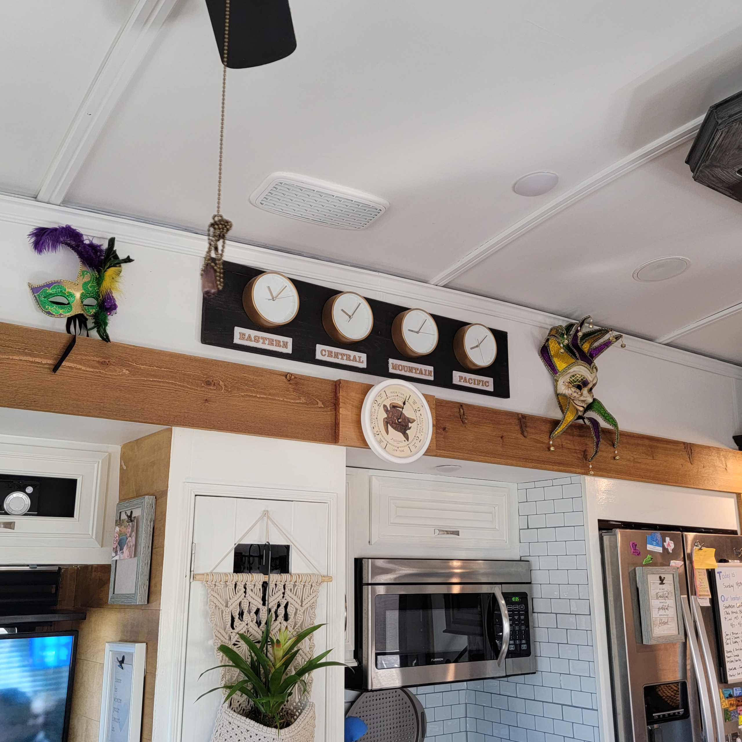 Homer the RV kitchen wall update with new paint and clock wall